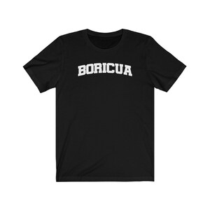 May include: Black t-shirt with white text that reads "BORICUA" in an arched font.