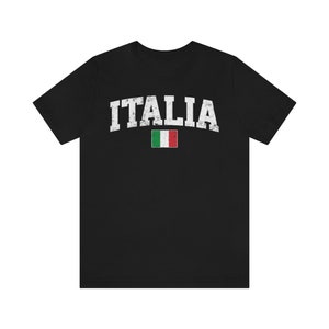 May include: Black t-shirt with a white vintage-style graphic of the word "ITALIA" and the Italian flag.