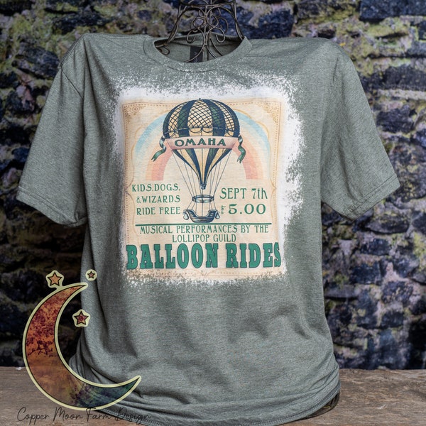 Balloon Rides on Unisex sized bleached heather green cotton polyester blend t-shirt. Based on The Wizard of Oz.