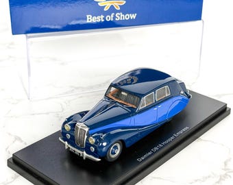 May include: A miniature Daimler DB18 Hooper Empress car model in shades of blue, displayed on a black base. The model has detailed features and is presented with a "Best of Show" box.