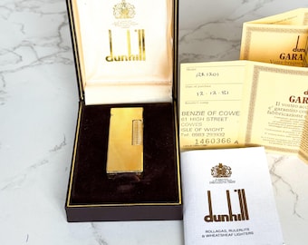 Encendedor Dunhill Rollagas Swiss Made de 1981, chapado en oro, juego completo en caja.