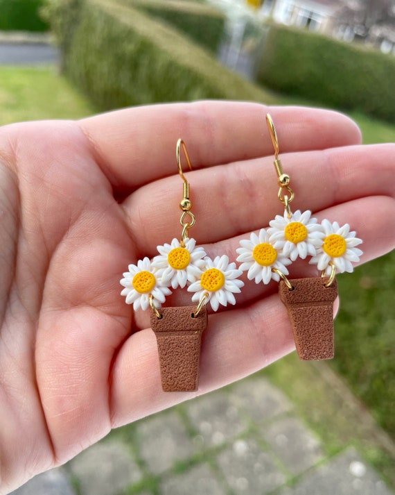 Daisy clay earrings deals