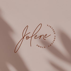 May include: A logo for a vintage concept store called "Jolene". The logo is a handwritten script font in brown against a light brown background.