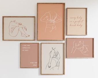May include: A collection of framed art prints featuring minimalist line drawings of the human form. The prints are in neutral tones of beige, peach, and pink, with wooden frames. Some prints include text: "I LOVE AND APPRECIATE MY BODY" and "every body is a perfect beach body."