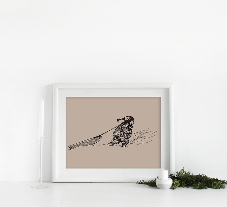 May include: Black and white framed print of a child pulling a sled through the snow. The illustration has a vintage aesthetic, with the child wearing a hat and winter clothing. The background is a muted tan color.