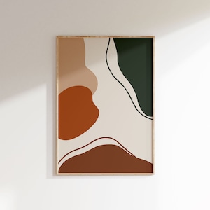 Puede incluir: Lámina de arte abstracto enmarcada en madera. La obra presenta formas orgánicas en tonos marrón, óxido y verde sobre un fondo crema. El diseño tiene una estética minimalista, adecuada para la decoración moderna del hogar.