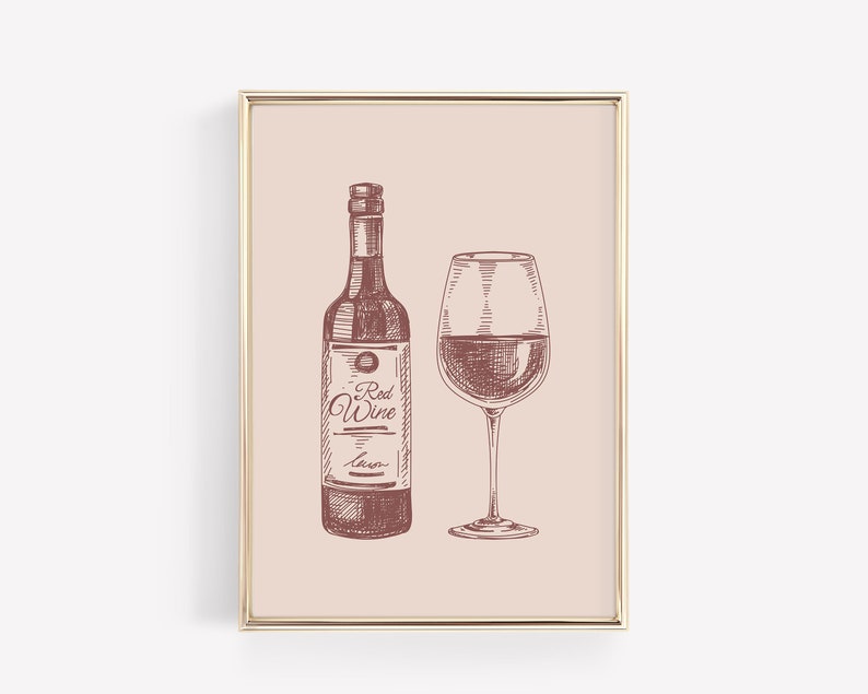 May include: A framed print featuring a sketch of a wine bottle and a wine glass, both filled with red wine. The bottle has a label that reads "Red Wine". The artwork is in shades of brown and red on a light pink background.