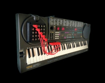 Yamaha PSS 795 Vector AWM Synth + Patch Bay & Randomiser Switch.