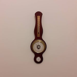 Klik British Barometer. Vintage wooden nautical barometer with thermometer and hydrometer. Historic traditional weather station barometer.