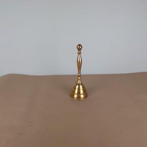 Vintage brass Victorian hand dinner bell