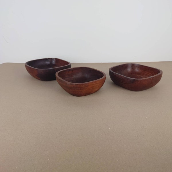 Three wooden dipping bowls Bowls for sauces. Meze. Tapas. Three small serving bowls.