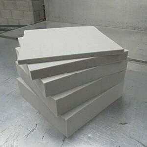 May include: A stack of five white foam squares. The squares are all the same size and are stacked on top of each other.
