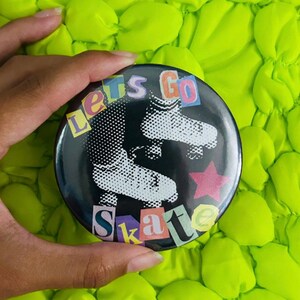 May include: A white ceramic mug with a black handle and the text "But First, Coffee" in a black, bold font. The mug is sitting on a wooden surface.