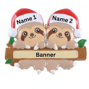 May include: Two brown sloths wearing red Santa hats with the names "Name 1" and "Name 2" printed on the hats. The sloths are holding a wooden sign with the word "Banner" printed on it.