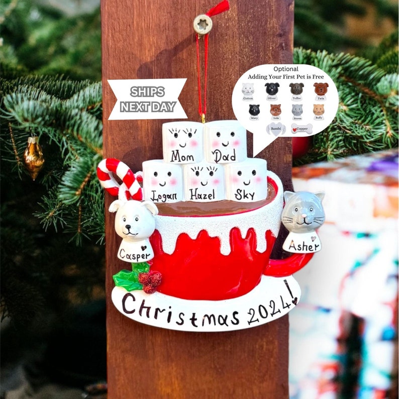 Celebrate the holidays with this Personalized Family Hot Cocoa Ornament – Christmas 2025, a charming keepsake featuring your loved ones’ names on smiling marshmallows. This Custom Marshmallow Family Ornament – Holiday 2025 Keepsake is perfect for cozy Christmas vibes and makes a great addition to your tree. Designed as a Christmas Mug Ornament with Names – Family of 5 – 2025, it’s a heartwarming way to mark the season. Our Hot Chocolate Family Ornament – Christmas Tree Decor 2025 Ornament