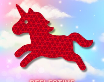 May include: A red unicorn silhouette featuring a repeating triangular geometric pattern across its surface. The unicorn is depicted in a leaping pose with a single horn on its head. Below the unicorn, the word REFLECTIVE is printed in capital letters.