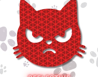 May include: A red cat-shaped decal featuring a geometric triangular pattern and a grumpy facial expression with pointed ears and whiskers. The word REFLECTIVE is printed in red capital letters below the cat head, set against a white background.