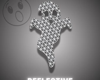 May include: A ghost-shaped decal featuring a white geometric triangular grid pattern on a dark grey background. The word REFLECTIVE is printed in white capital letters at the bottom, and a faint outline of a surprised face icon appears in the top left.
