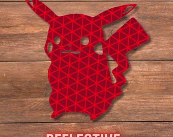 May include: Red reflective Pikachu silhouette with a geometric pattern, set against a wooden background. The word "REFLECTIVE" is displayed in a red font at the bottom of the image. The design is a stylized representation of the popular character.