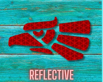 May include: A collection of red reflective decals featuring a geometric triangular grid pattern. The individual adhesive shapes are arranged in a cluster, and the word REFLECTIVE is printed in light pink capital letters at the bottom.