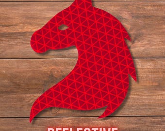 May include: A red horse head silhouette featuring a repeating geometric triangle pattern across its surface. The design is made of a reflective material and is positioned above the word REFLECTIVE printed in a bold, light-coloured sans-serif font.