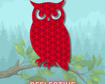 May include: A red owl-shaped decal featuring a geometric triangular pattern throughout its body. The owl has pointed ears and large, stylized eyes. The word REFLECTIVE is printed in bold, red capital letters at the bottom of the image.
