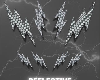 May include: A set of eight silver lightning bolt decals featuring a geometric triangular grid pattern. The decals are arranged in two rows of four, with the word REFLECTIVE printed in white capital letters at the bottom of the image.