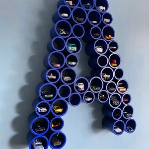 Letter wall display for toy cars