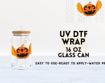 May include: A 16 ounce glass can with a UV DTF wrap featuring a cartoon pumpkin with a stitched face. The wrap is easy to use, ready to apply, and water proof.