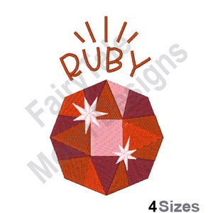 May include: Embroidered design of a red ruby gemstone with white stars, surrounded by the word "RUBY" in orange lettering with radiating lines above.