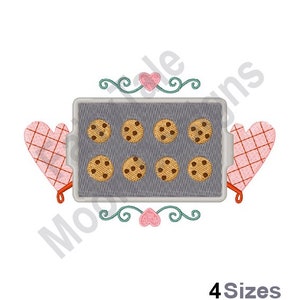 May include: A baking sheet with nine chocolate chip cookies, two pink oven mitts with white checkered patterns, and a decorative design with hearts and swirls.