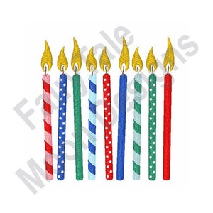 May include: Ten colorful birthday candles with red, blue, and green stripes and polka dots. The candles have yellow flames.