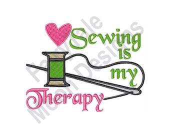 May include: A pink heart, a green spool of thread, and a needle and thread are arranged to form the letter "I". The text "Sewing is my therapy" is written in green letters.