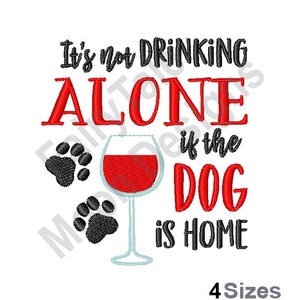 May include: It's not drinking alone if the dog is home. Red text with a glass of red wine and two black paw prints.
