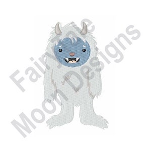 May include: An embroidered design of a friendly yeti with a light blue face and a white furry body. The yeti has small horns, a smiling mouth, and is standing upright. The text "Fairie Moon Designs" is in the background.