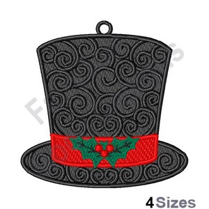 May include: Black and red Christmas ornament shaped like a top hat with a green holly sprig and red berries.