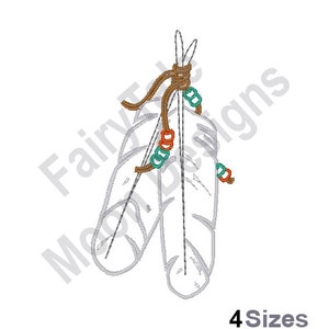 May include: Two white feathers tied together with a brown cord and decorated with orange and teal beads.
