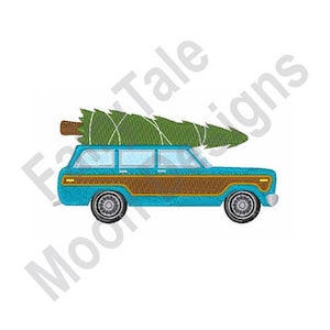 May include: A blue station wagon with wood paneling is carrying a green Christmas tree on top. The car is facing right and has a white background.