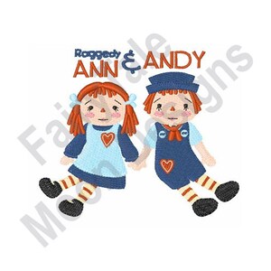 May include: Raggedy Ann & Andy embroidered design featuring two dolls holding hands. Ann is wearing a blue dress with a red heart and Andy is wearing a blue sailor outfit with a red heart.