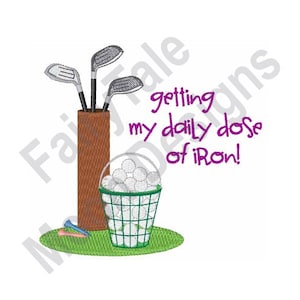May include: A brown golf bag with three golf clubs sticking out of the top. A green basket filled with white golf balls sits in front of the bag. The text "getting my daily dose of iron!" is written in purple cursive.