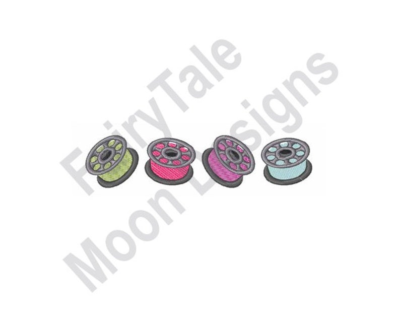 May include: Four colorful spools of thread in green, pink, purple, and blue. Each spool has a silver-colored base and a matching center. The spools are arranged horizontally on a white background.