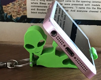 Mobile phone stand of Alien with keyring, grey and green Alien holding phone, great for Christmas crackers,  Presents under 10 Pounds,
