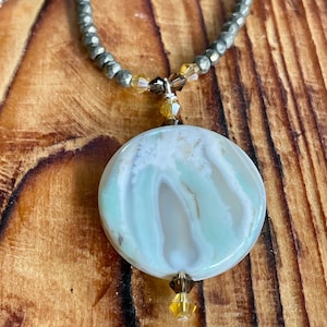 Pyrite Beads with Light and Dark Brown crystals with a light Blue, brown and creme Arctic Terra Agate Coin Pendant