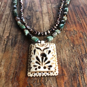 Double strand with brown/green polished jasper chiklets, brown/bronze pearl & crystal strand with etched bone focal bead
