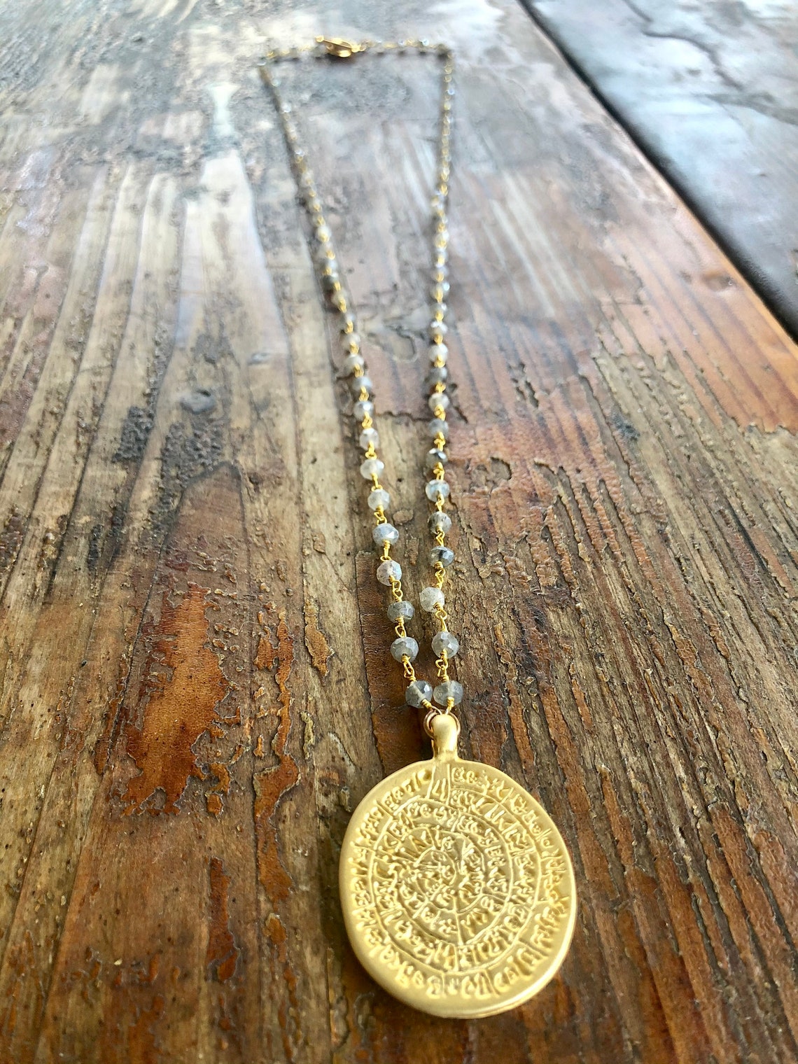 gold-greek-calendar-medallion-on-labradorite-gold-wrapped-etsy