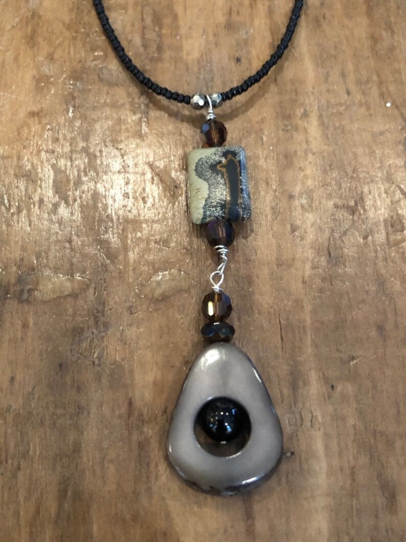 Gray Taqua Nut Open slice with black onyx round bead Rectangle bead and Black seed beads /&Sterling toggle and Picture Jasper BrownGray