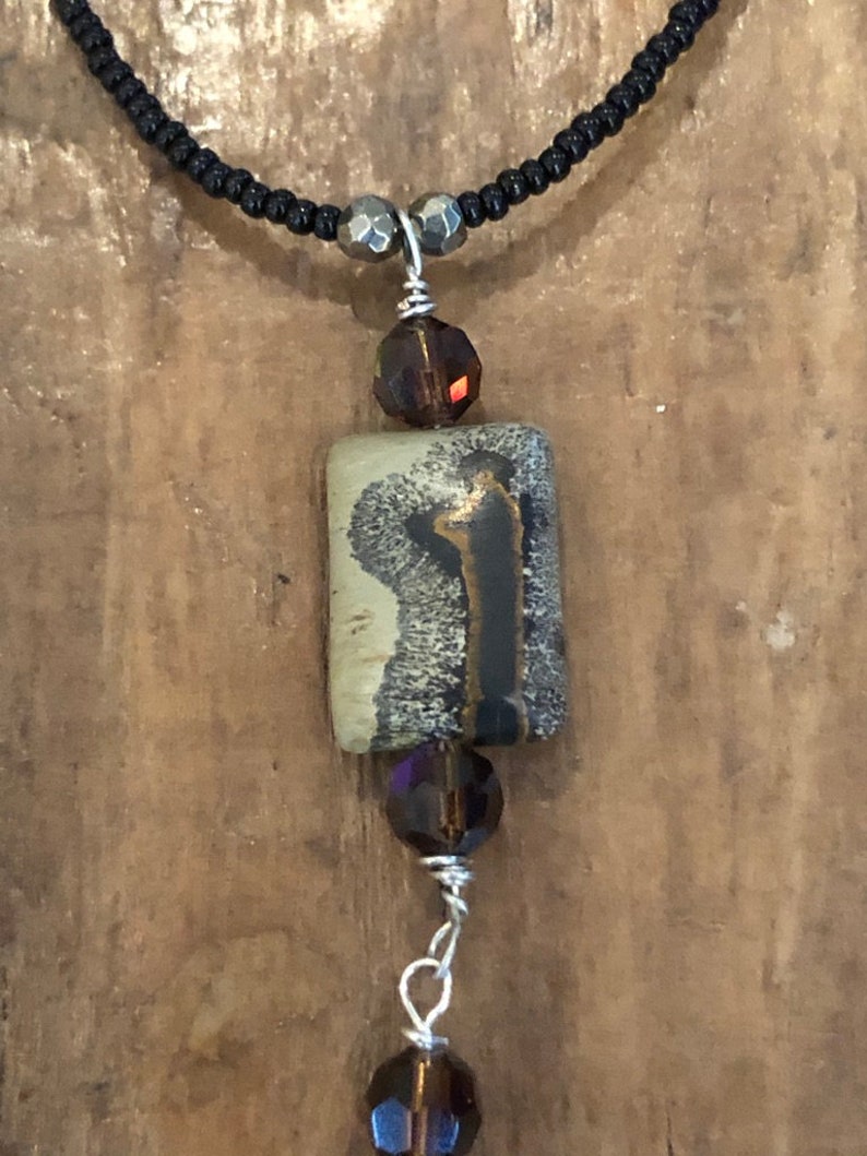 Gray Taqua Nut Open slice with black onyx round bead Rectangle bead and Black seed beads /&Sterling toggle and  Picture Jasper BrownGray