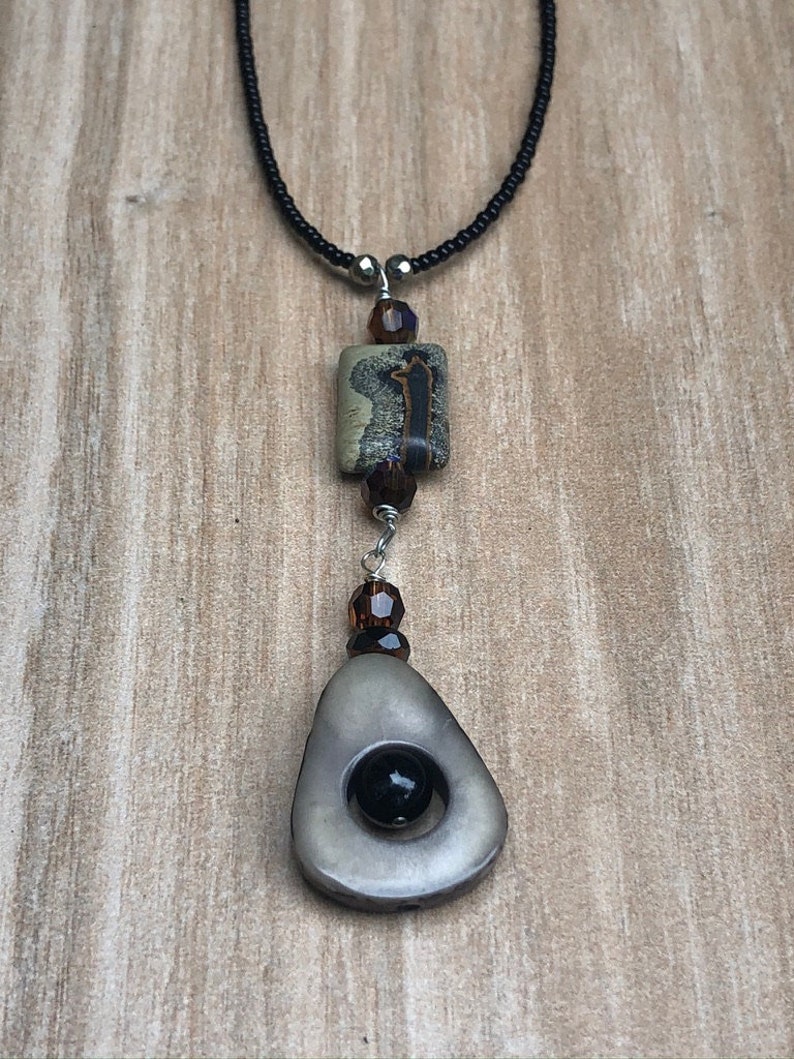 Gray Taqua Nut Open slice with black onyx round bead Rectangle bead and Black seed beads /&Sterling toggle and Picture Jasper BrownGray