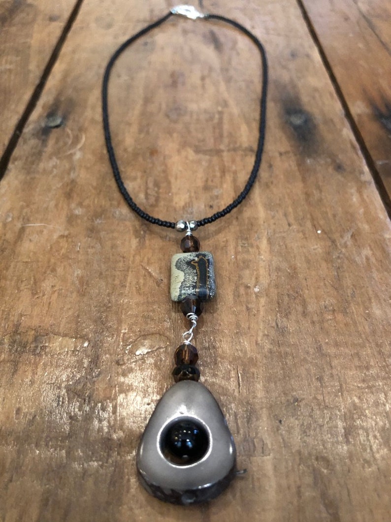 Gray Taqua Nut Open slice with black onyx round bead Rectangle bead and Black seed beads /&Sterling toggle and Picture Jasper BrownGray