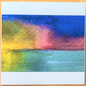 May include: Abstract watercolor painting of a sunset over a body of water. The sky is a mix of yellow, pink, purple, and blue. The water is a light blue and green.